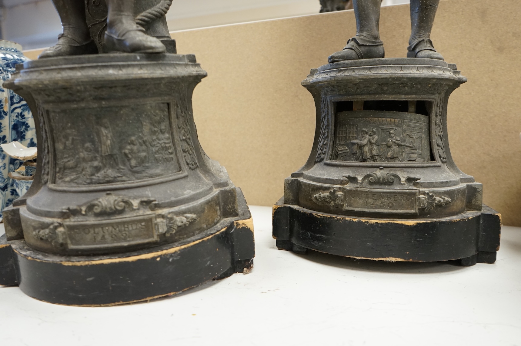 A pair of Victorian spelter figures of Columbus and Gutenberg, 73cm high (damaged)